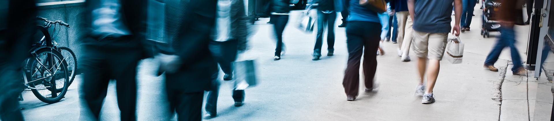 Banner image of a people walking 