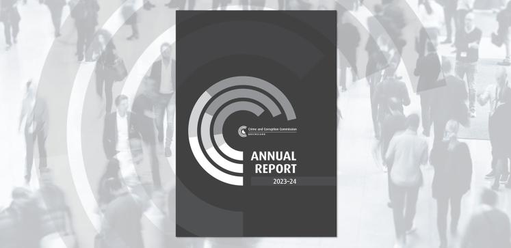 Cover image of the CCC Annual Report 2023-24 in front of an image of people walking in a crowd.