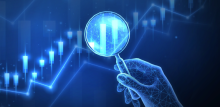 Image of magnifying glass looking at data 